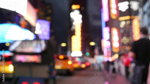 New York City Times Square, Manhattan Midtown Broadway street, USA. American NYC yellow taxi cab, urban road traffic. People. Advertising signs, commercial ads, illuminated billboard screens glowing.