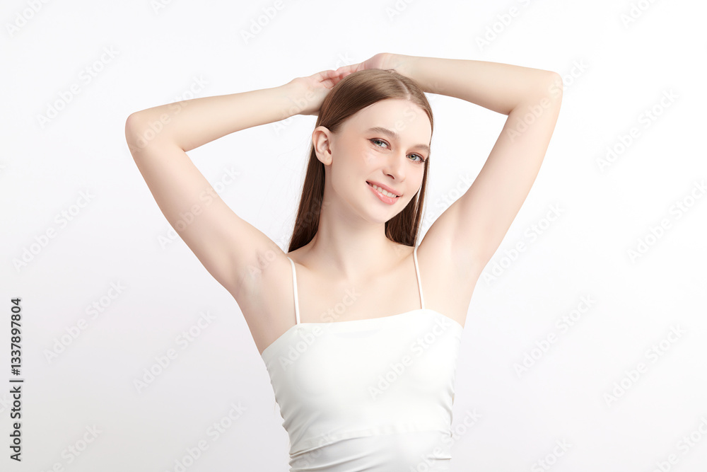 A beautiful young woman raises her arms to display her smooth and hygienic underarms against a white background, highlighting the concept of cleanliness and protection A beautiful young woman raises her arms to display her smooth and hygienic underarms against a white background, highlighting the concept of cleanliness and protection