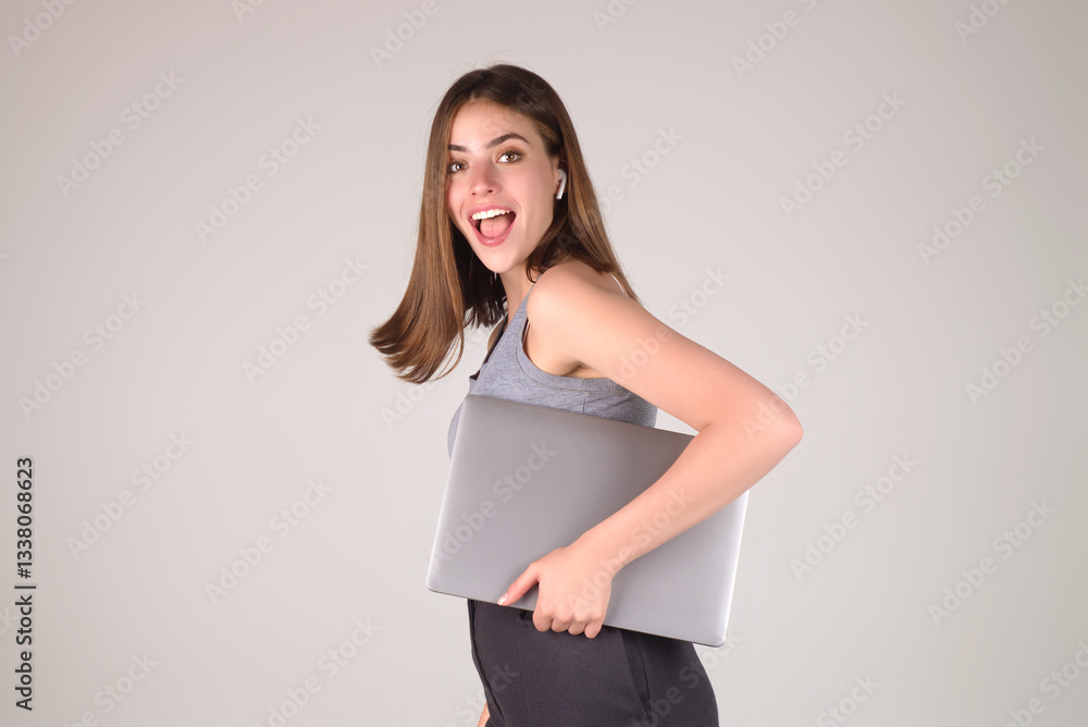 Happy Student. Woman Student in white t-shirt holding laptop and laptop, isolated over gray background. Student posing in studio. Portrait of student having video-call. Students time. Happy Student. Woman Student in white t-shirt holding laptop and laptop, isolated over gray background. Student posing in studio. Portrait of student having video-call. Students time.