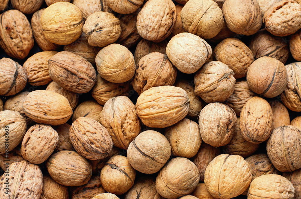 Top view of whole walnuts as background texture Top view of whole walnuts as background texture