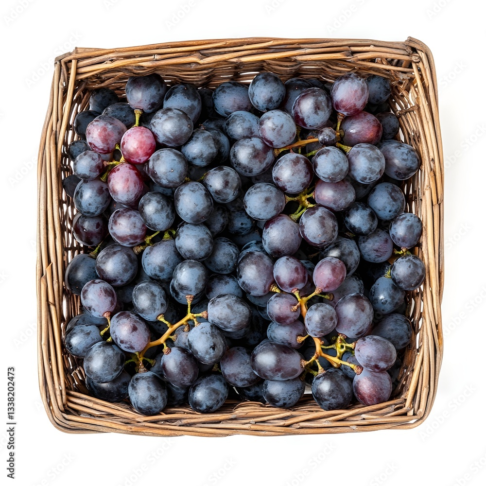 Fototapeta premium Freshly Harvested Purple Grapes in Woven Basket Top View Isolated