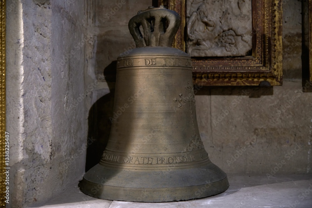 Obraz premium Antique Bronze Bell in Historical Setting