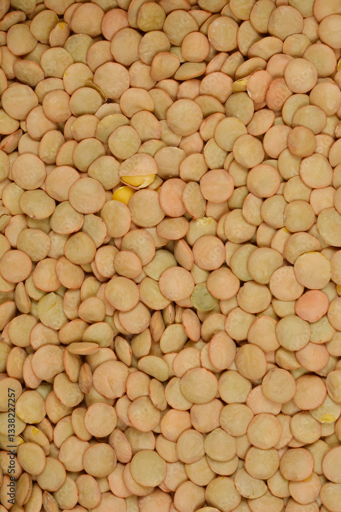 A top-down, close-up shot of a mass of green lentils, showcasing their texture and color A top-down, close-up shot of a mass of green lentils, showcasing their texture and color
