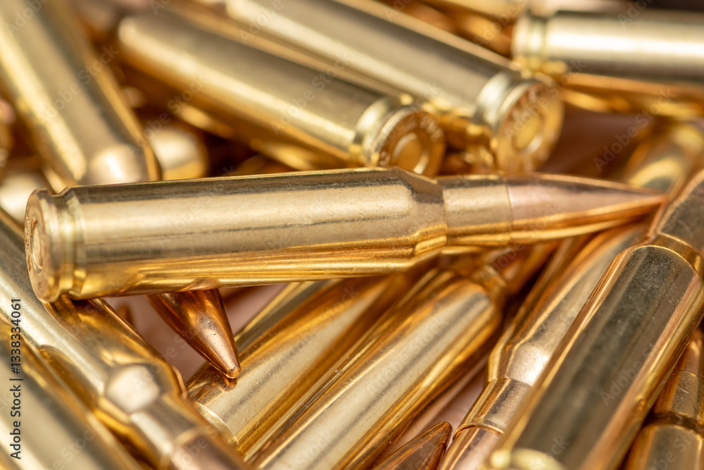 Naklejka premium shiny rifle cartridges, Symbolism of war, weapons and national resistance.