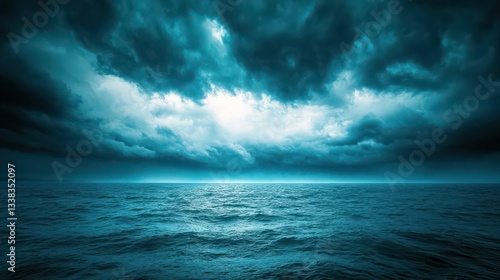 The calm before the storm as dark clouds move in over the sea, the sky becoming more ominous and the water starting to stir with rising winds.