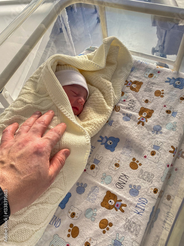 Obraz na płótnie Newborn Baby in Hospital Bassinet with Bear Sheet w salonie
