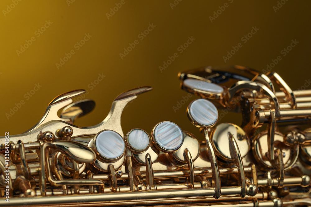 Obraz premium Jazz. One beautiful saxophone on color background, closeup