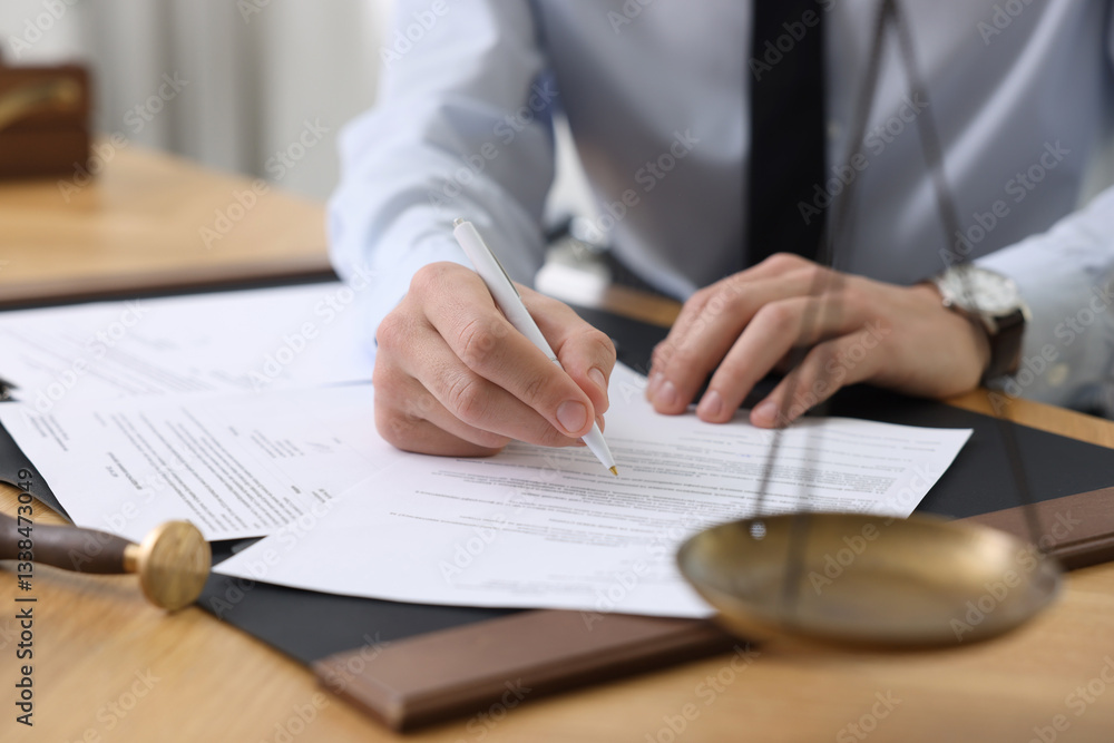 Notary signing document at table in office, closeup. Space for text Notary signing document at table in office, closeup. Space for text