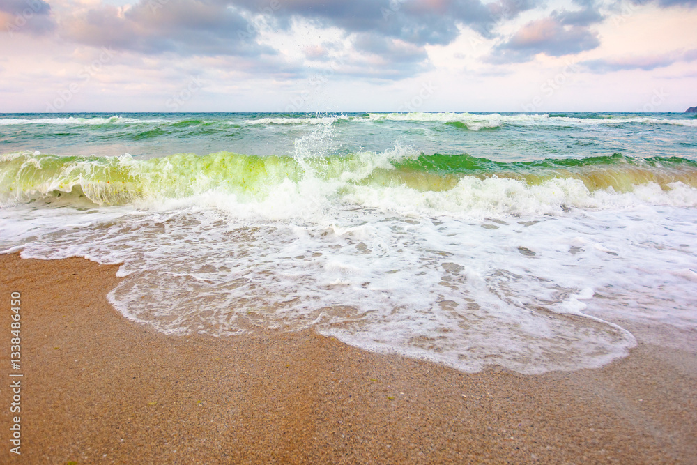 nature background with sea tide. water surface motion at storm. wave splash with foam on the wet beach. summer outdoor weather with wind. beautiful view of travel wallpaper with horizon