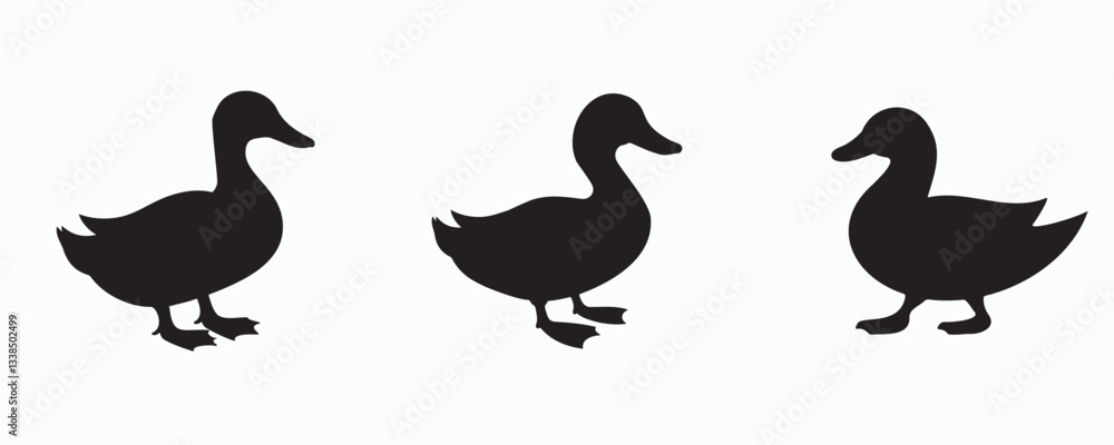 Fototapeta premium Set of three black duck silhouettes in various poses on a light gray background, showcasing different stances and movements