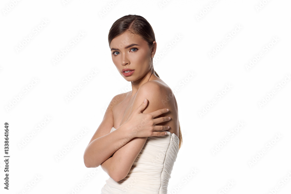 Elegant young woman posing gracefully in a chic fashion setting with a confident expression Elegant young woman posing gracefully in a chic fashion setting with a confident expression