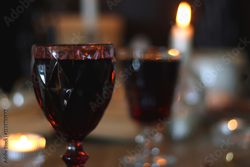 Obraz na płótnie Books, lit candles, red wine, snacks and various deocration on the table. Dark academia or Halloween concept. Selective focus. w salonie