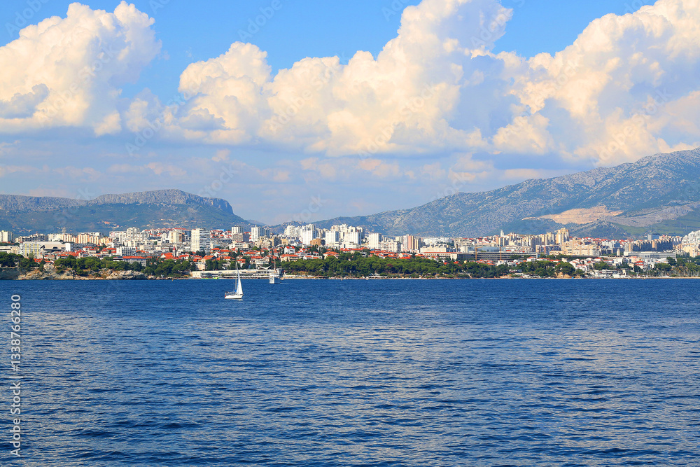 Contemporary buildings, gardens and beaches at the waterfront in Split, Croatia. View of Split from the boat.