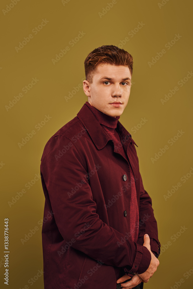 Stylish young man showcases trendy fashion in a modern studio setting Stylish young man showcases trendy fashion in a modern studio setting