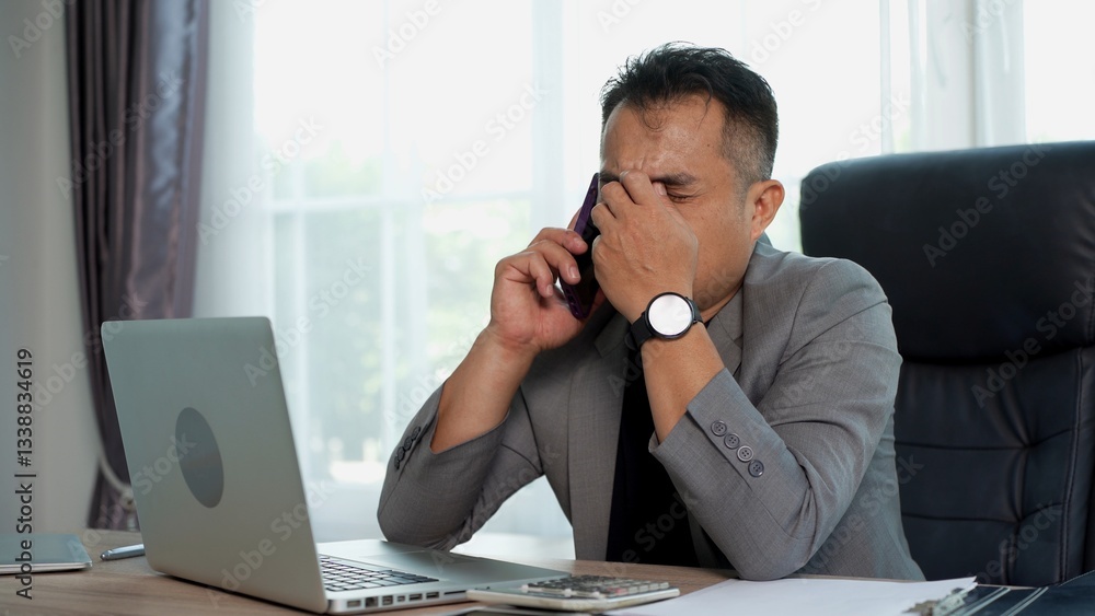 Businessman feel shock and Disappointed during talking on Phone Businessman feel shock and Disappointed during talking on Phone
