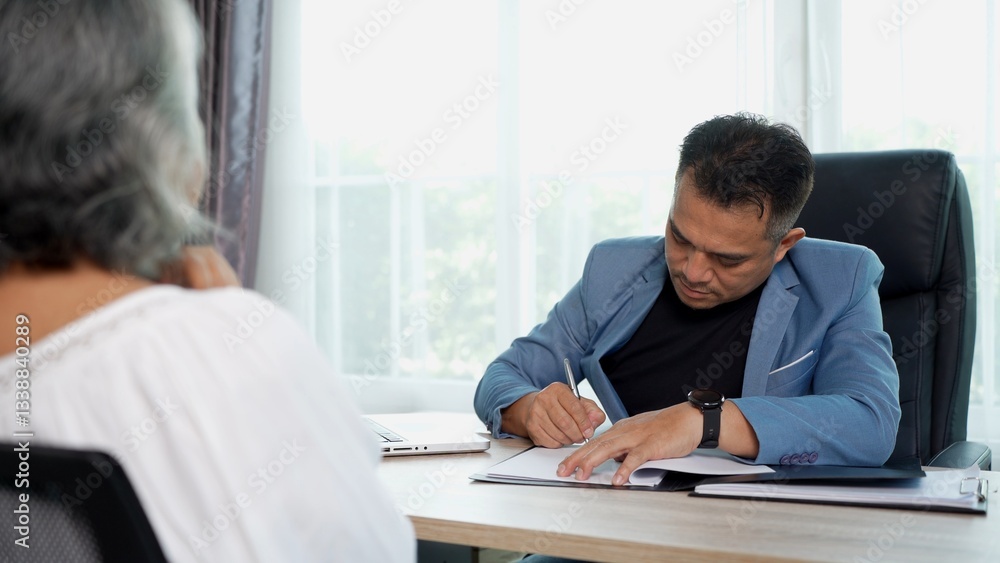 Professional consultation between advisor and senior client Professional consultation between advisor and senior client