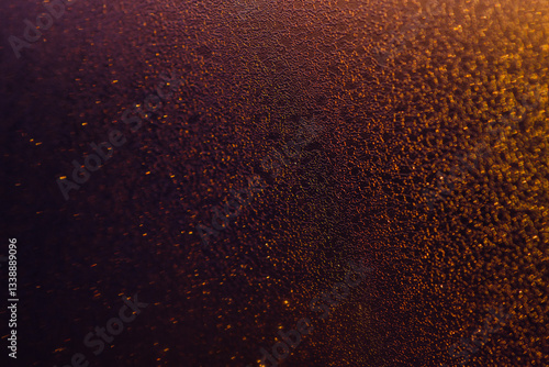 Blurred bokeh light sparkle on golden black background