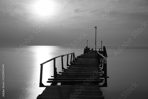 Wallpaper Mural Old wooden pier extends into the sea on Koh Samet, Thailand. Crooked wooden rails are attached to the sides. Long exposure makes the sea smooth. Sunlight creates a shimmering path to the horizon Torontodigital.ca