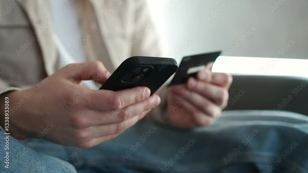 Online shopping.
Bank card in hands.
Person using bank card.
Person with credit card and phone in hands.
Person paying for services online Online shopping.
Bank card in hands.
Person using bank card.
Person with credit card and phone in hands.
Person paying for services online