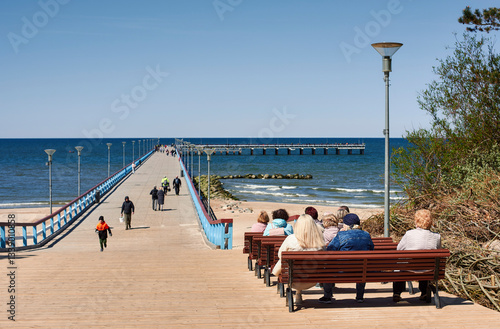 People taking a pause to admire boundless Baltic sea