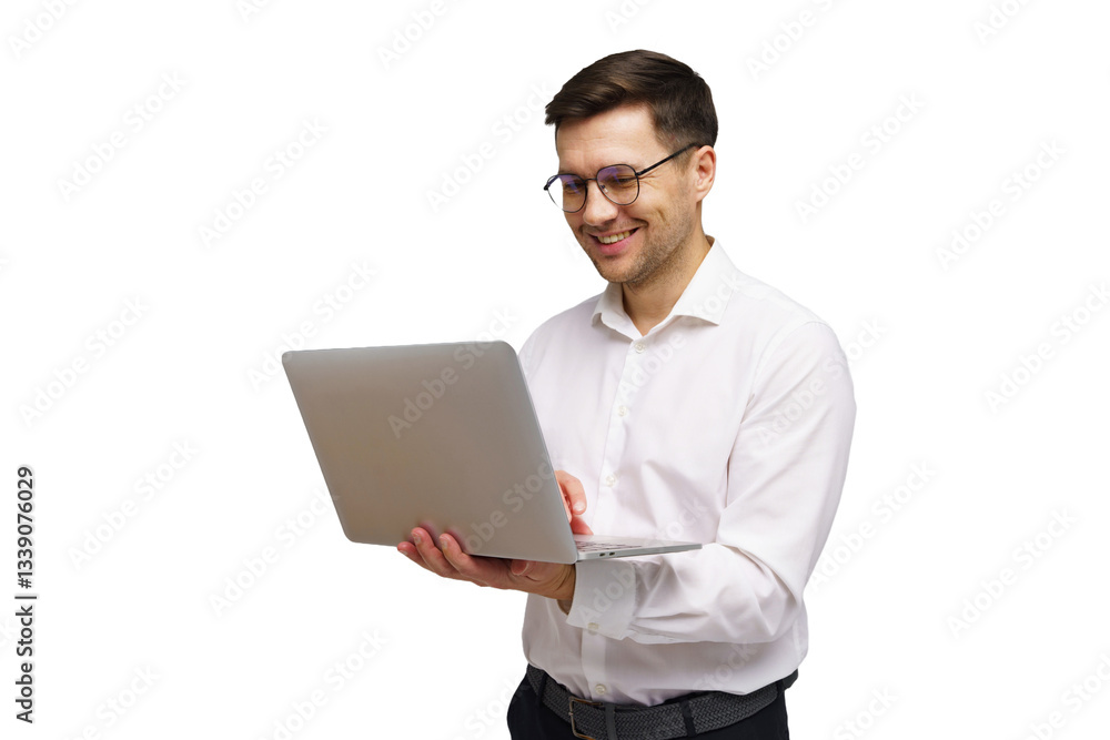 Smiling man in white shirt working on laptop while standing against a white background Smiling man in white shirt working on laptop while standing against a white background