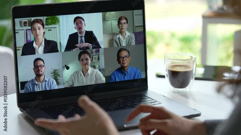 Online business video conference for internal team meeting and external meeting showing business persons of multiple genders and ages on screen Online business video conference for internal team meeting and external meeting showing business persons of multiple genders and ages on screen