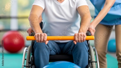 A person in a wheelchair participates in a physical therapy session, utilizing a balance ball with assistance from a therapist in a gym environment.