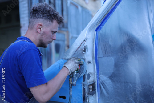 man polishing car paint before painting, truck repair