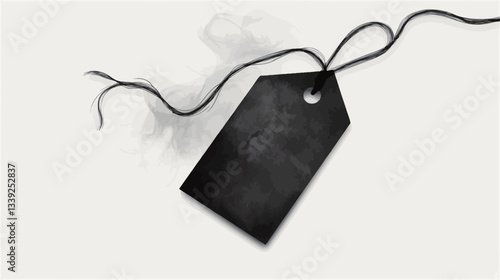 High-angle, close-up shot of a blank black rectangular tag with a hole at the top.  The tag is tied with a dark-colored string which is slightly loose. The tag has a slightly textured surface. The