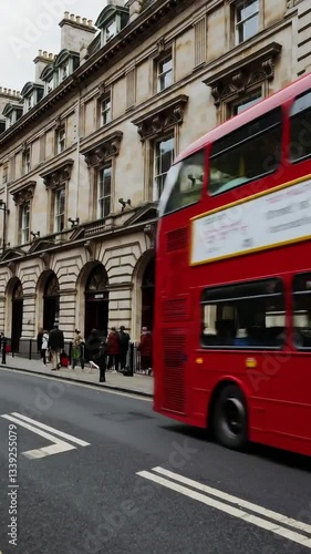 Vibrant doubledecker buses navigate bustling urban street amidst historic architecture