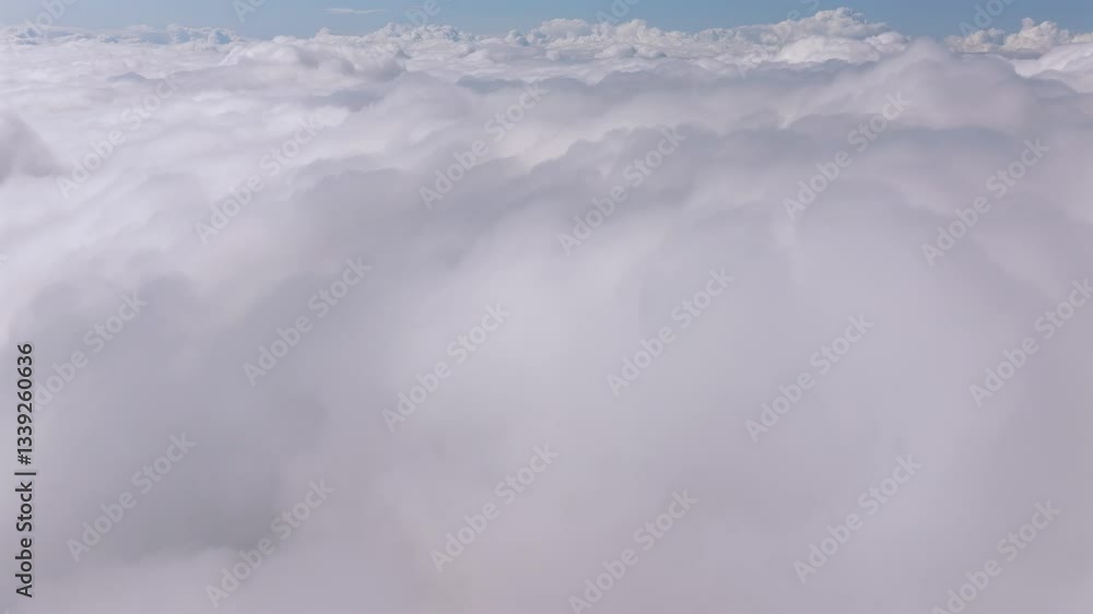 Flying over the clouds. Aerial 4k video with a beautiful clouds landscape view. World above the cumulus and cumulonimbus clouds. Sea of clouds under blue sky. Serenity and peaceful 4k video. Flying over the clouds. Aerial 4k video with a beautiful clouds landscape view. World above the cumulus and cumulonimbus clouds. Sea of clouds under blue sky. Serenity and peaceful 4k video.