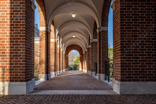 Old arched brick walkway with brick pillars