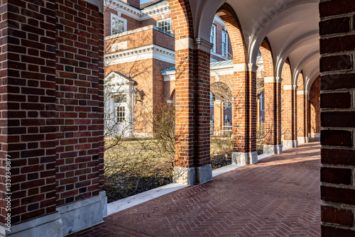 Old arched brick walkway with brick pillars