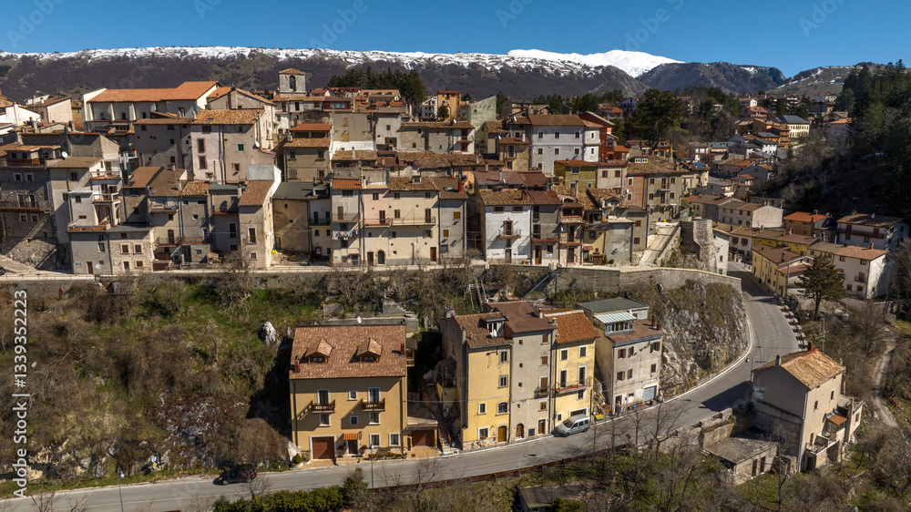Obraz premium Aerial view of historic center of Ovindoli, a town located in the province of L'Aquila, in Abruzzo, Italy. It is a popular winter resort in the Apennines. In background is the Velino mountain range.