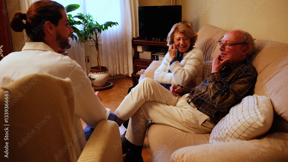 Male doctor speaking with senior couple during home visit, providing medical advice and explaining diagnosis