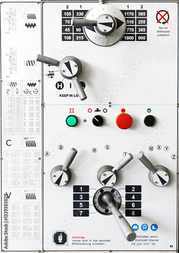 Lathe machine control panel. A close-up of a lathe machine control panel with feed adjustment levers. 