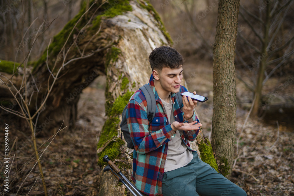 man hiker left voice message mobile phone on hiking trip near rocks man hiker left voice message mobile phone on hiking trip near rocks