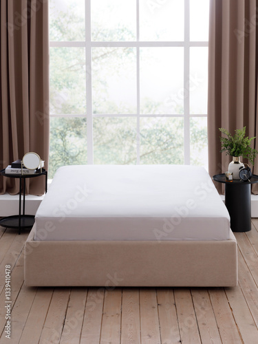Elegant double bed with a gray fitted sheet on mattress and two bedside tables in front of a large window with brown curtains in a modern style bedroom. Front view photo. Suitable for mockup