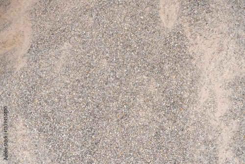 Pile of crushed stones and sand. Construction materials background. Gravel and sand texture for building and roadwork.