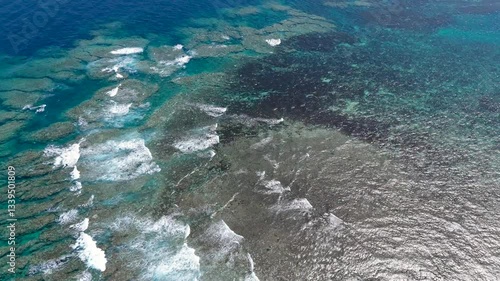 Aerial drone shots of waves hitting the reef, okinawa japan 