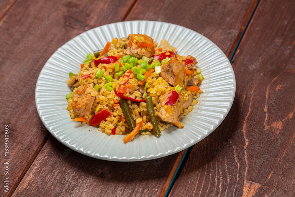 On a wooden table in a plate there are vegetables stewed with bulgur On a wooden table in a plate there are vegetables stewed with bulgur