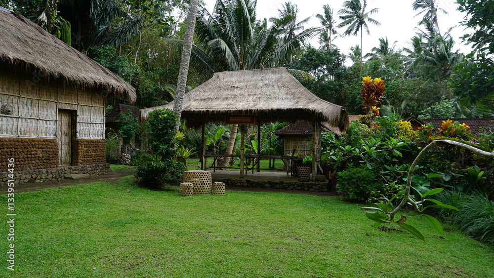Traditional Balinese houses made of rattan and surrounded by green plants at Bali Traditional Balinese houses made of rattan and surrounded by green plants at Bali