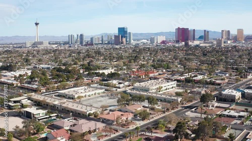 Aerial drone view of Las Vegas city skyline with residential homes and trees 04