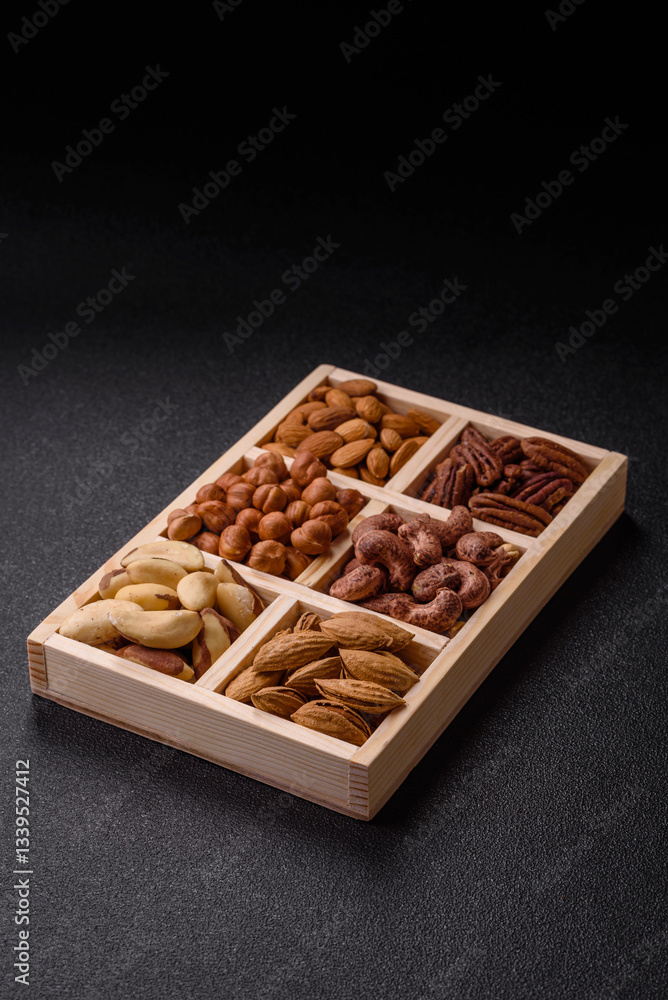 Wooden box with nuts cashew, hazelnut, almond, brazil, pecan, walnut