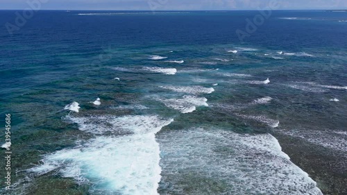 Aerial drone shots of waves hitting the reef, okinawa japan 