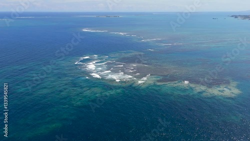 Aerial drone shots of waves hitting the reef, okinawa japan 