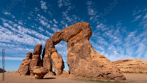 Time lapse of clouds motion over rock formation shape called dancing rock in Alula, Hegra, Madinah, Saudi Arabia.