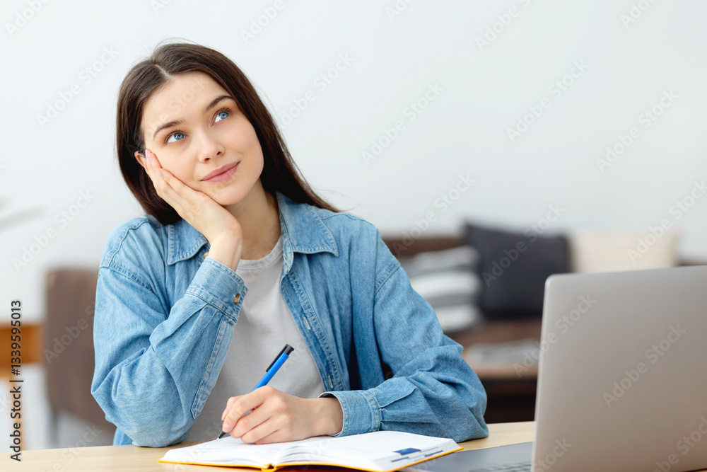 Young woman thinking and writing at home