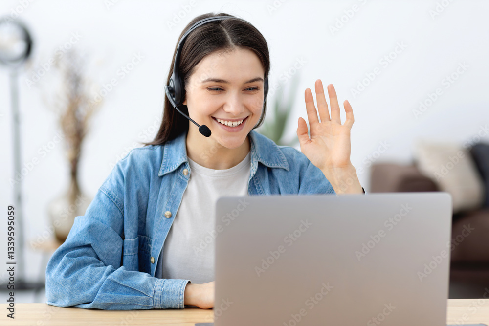 Smiling woman with headset during online meeting