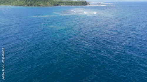 Aerial drone shots of waves hitting the reef, okinawa japan 